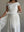 SLASH NECK PLEATED